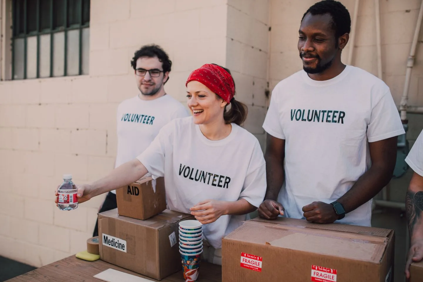 Volunteers organising supplies together at a community project